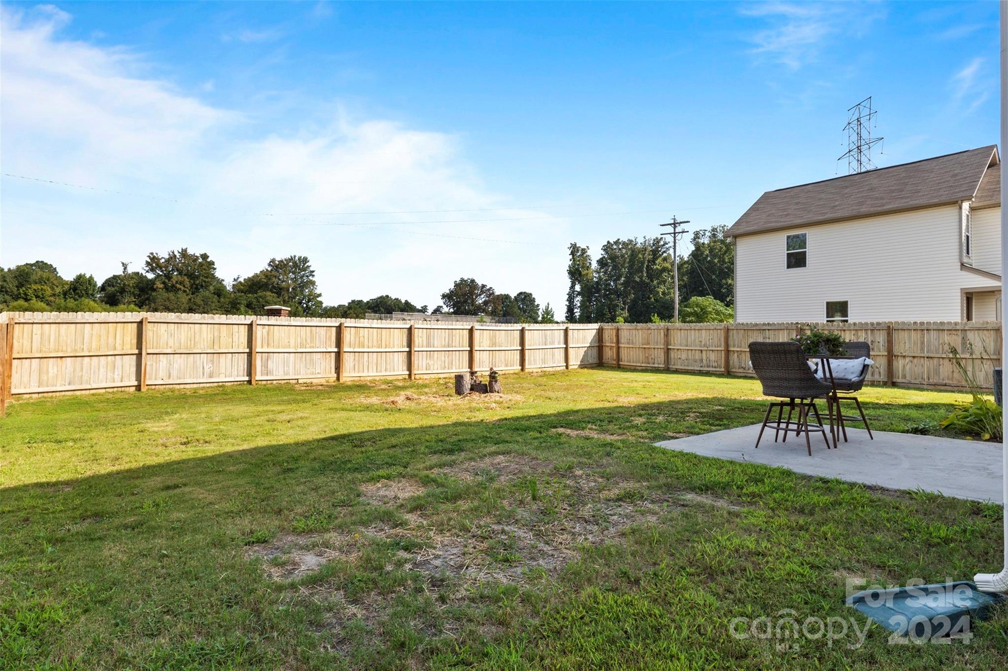 1015 Cherry Bark Place Landis, NC 28088 - Photo 23 of 24 a view of a swimming pool with a bench and trees in the background