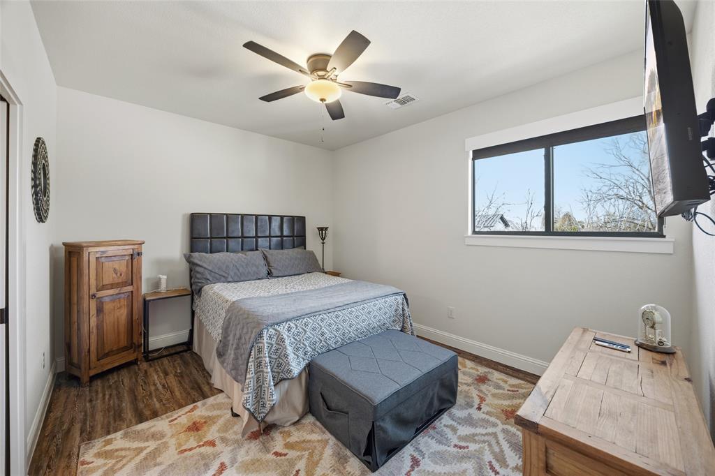 3105 Pastor Street Dallas, TX 75212 - Photo 20 of 28 Bedroom with ceiling fan and Luxury Vinyl wood like floors