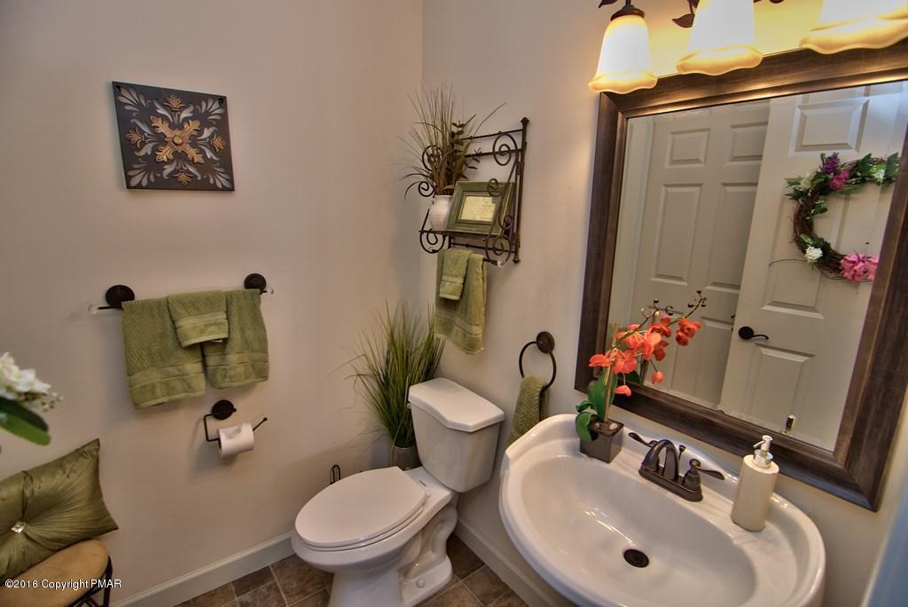 271 Williams Road Cresco, PA 18326 - Photo 11 of 46 a bathroom with a toilet sink and mirror