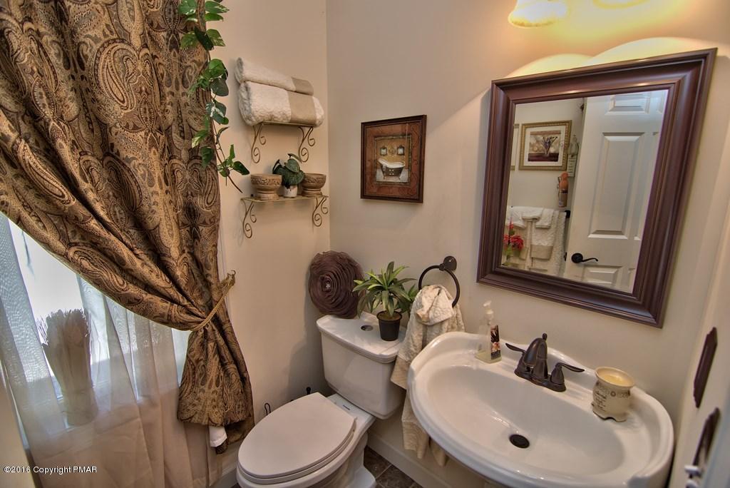 271 Williams Road Cresco, PA 18326 - Photo 13 of 46 a bathroom with a sink mirror and toilet