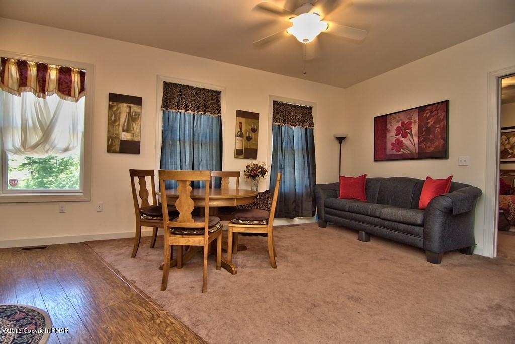271 Williams Road Cresco, PA 18326 - Photo 16 of 46 a living room with furniture and a large window