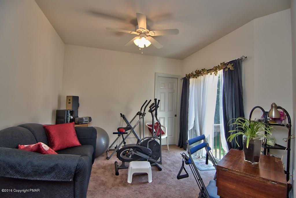 271 Williams Road Cresco, PA 18326 - Photo 18 of 46 a living room with furniture a chandelier and a potted plant