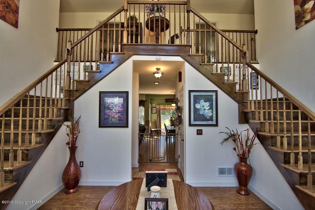 271 Williams Road Cresco, PA 18326 - Photo 2 of 46 a view of staircase with wooden floor and a front door