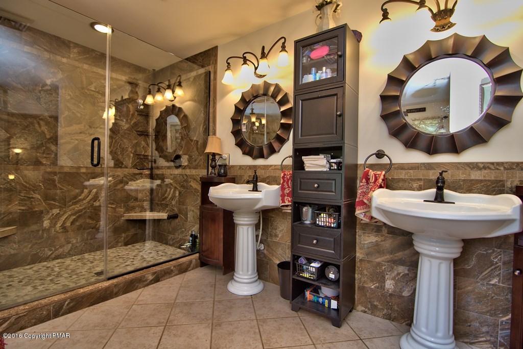 271 Williams Road Cresco, PA 18326 - Photo 22 of 46 a bathroom with a sink and mirror