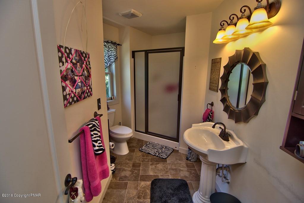 271 Williams Road Cresco, PA 18326 - Photo 27 of 46 a bathroom with a sink mirror and vanity