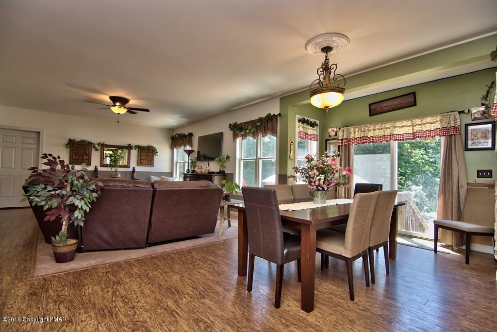 271 Williams Road Cresco, PA 18326 - Photo 8 of 46 a view of a dining room with furniture window and wooden floor