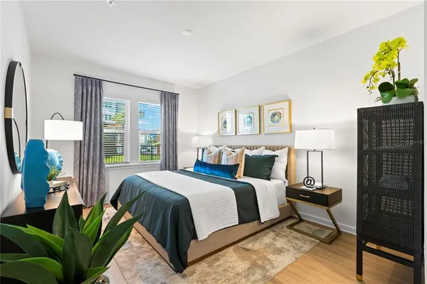 a bedroom with a bed and window