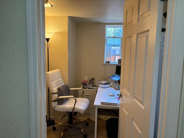 a dining room with furniture and window