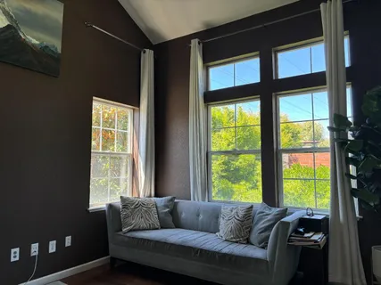a living room with furniture and a window