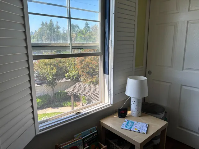 a table and a window in a room