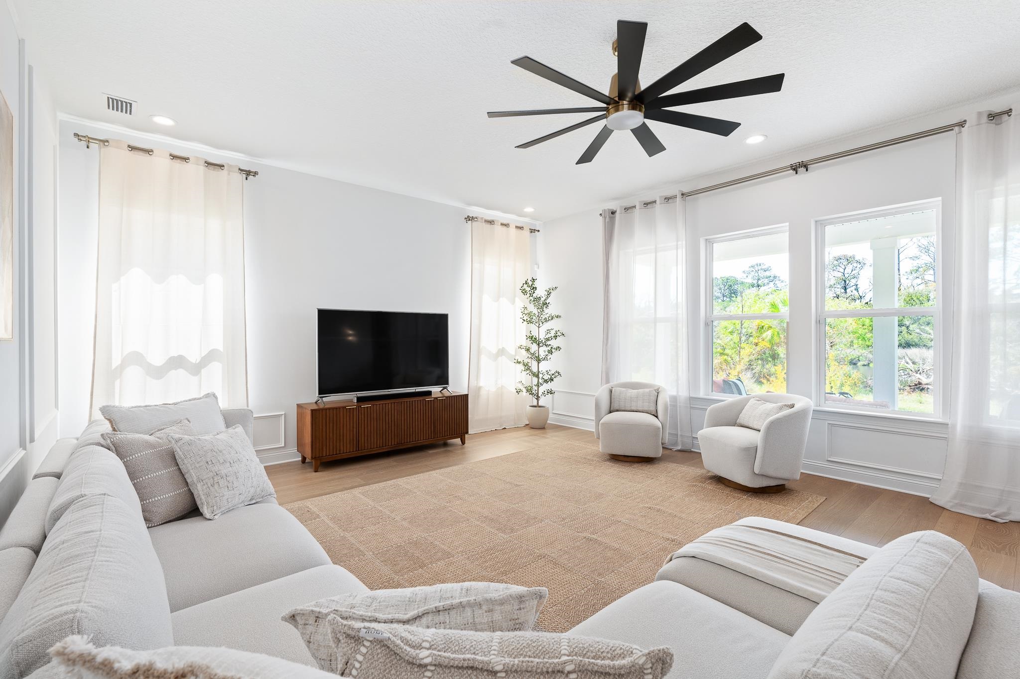 164 Tesoro Terrace St. Augustine, FL 32095 - Photo 12 of 98 a living room with furniture and a flat screen tv