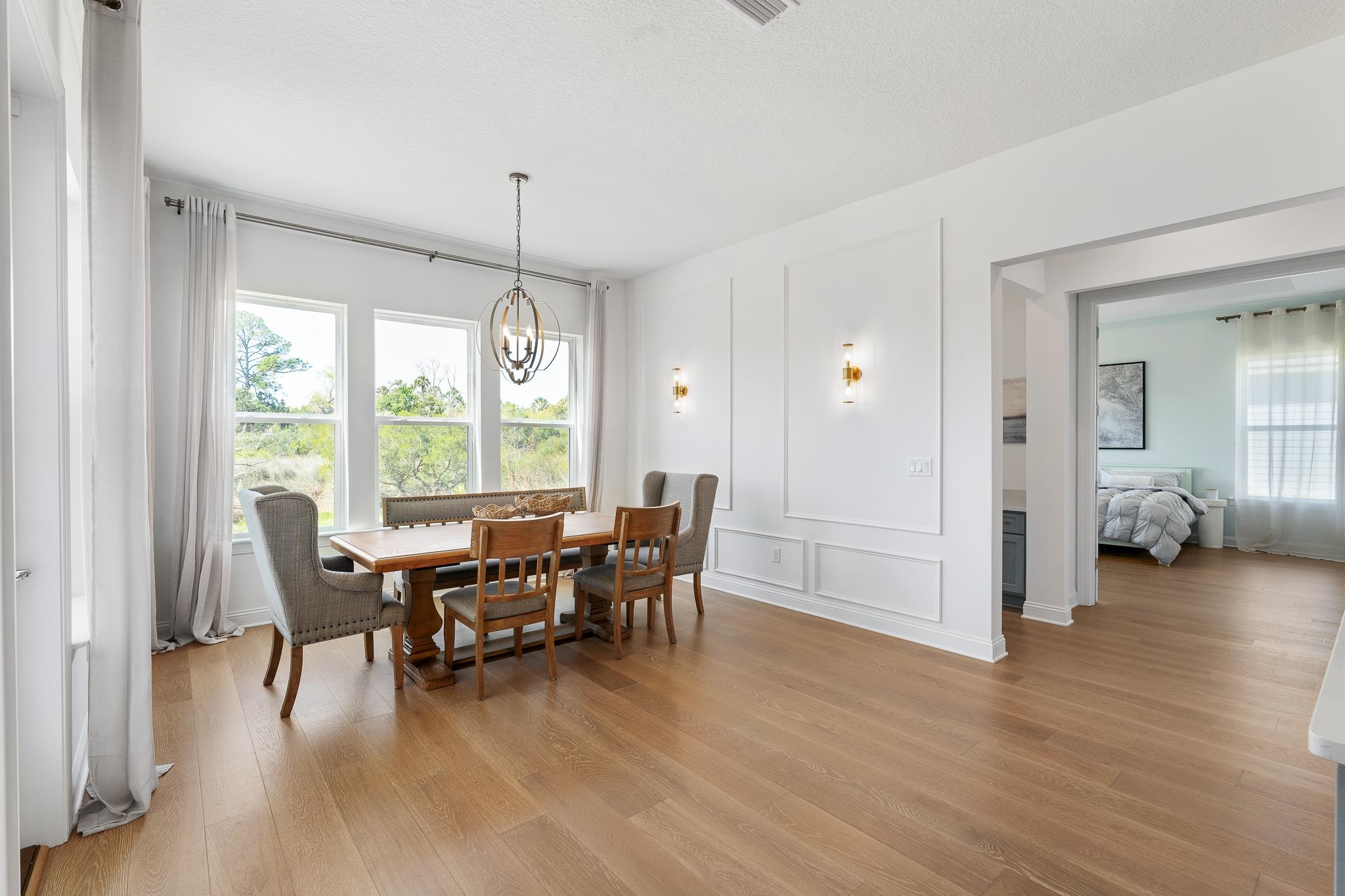 164 Tesoro Terrace St. Augustine, FL 32095 - Photo 27 of 98 a view of a dining room with furniture window and wooden floor