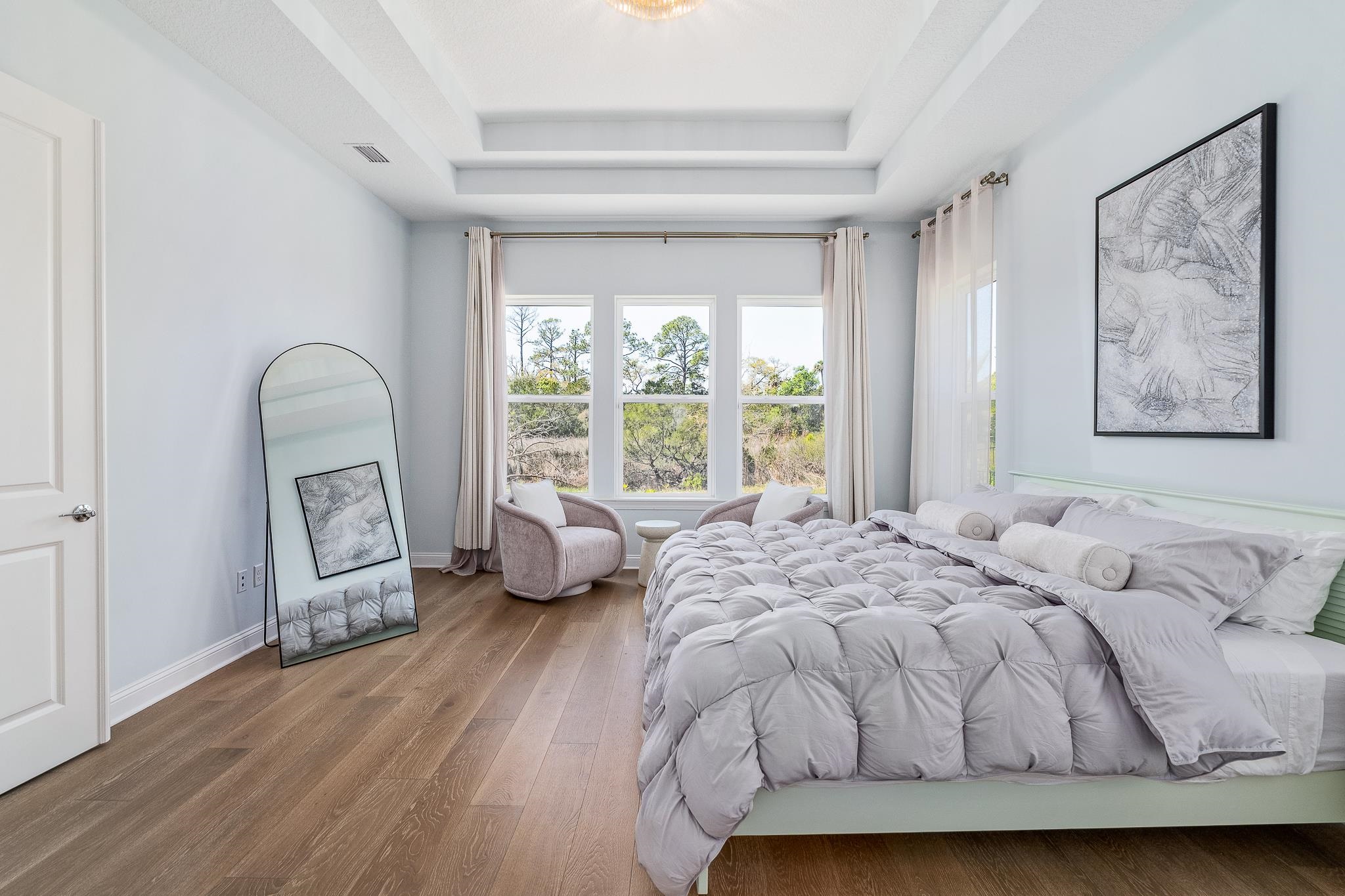 164 Tesoro Terrace St. Augustine, FL 32095 - Photo 30 of 98 a bed sitting in a bedroom next to a window