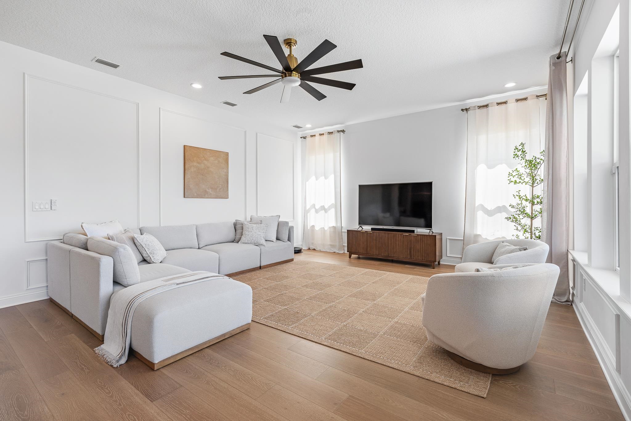 164 Tesoro Terrace St. Augustine, FL 32095 - Photo 39 of 98 a living room with furniture and a flat screen tv