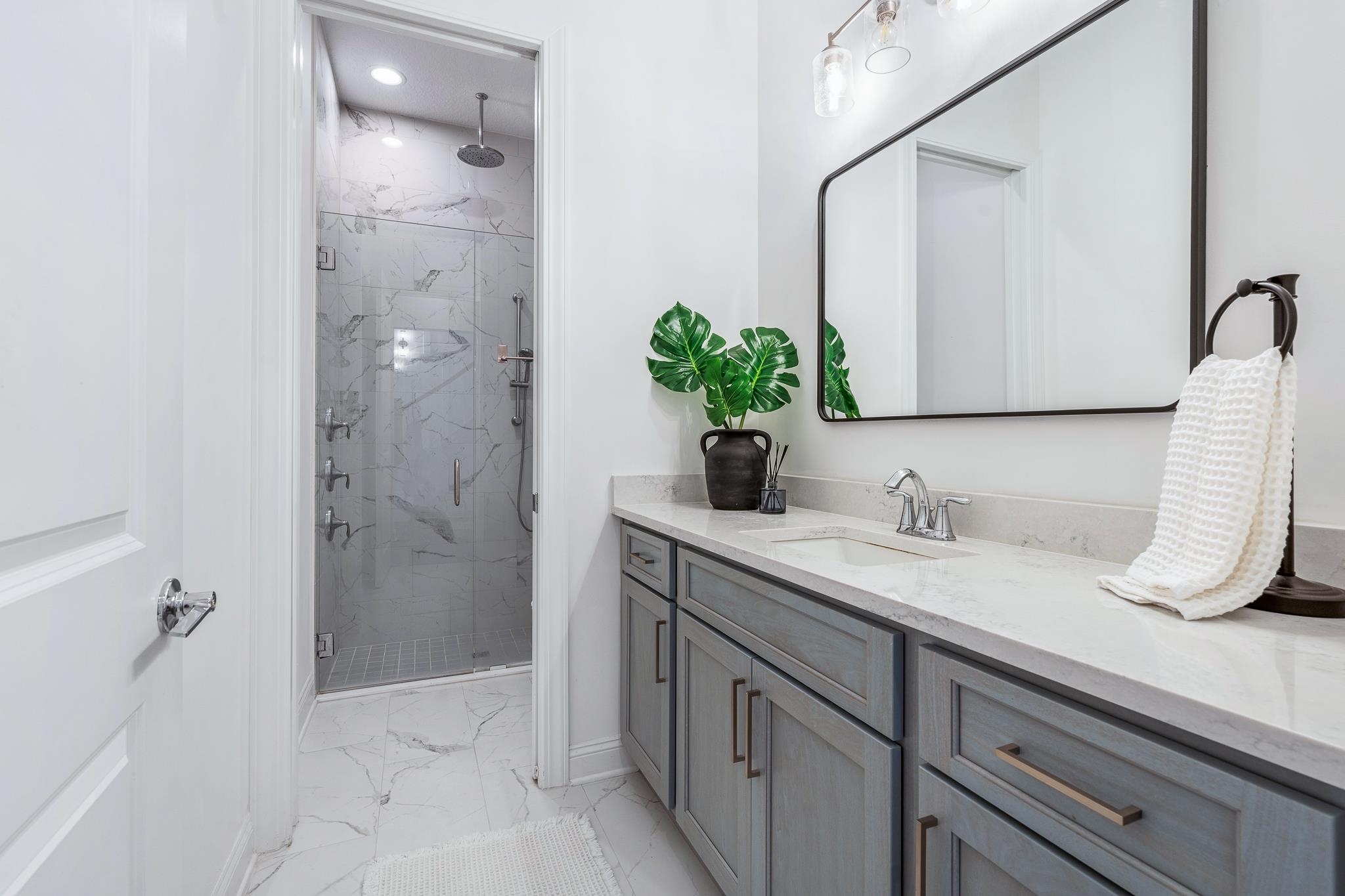 164 Tesoro Terrace St. Augustine, FL 32095 - Photo 42 of 98 a bathroom with a granite countertop sink and a mirror