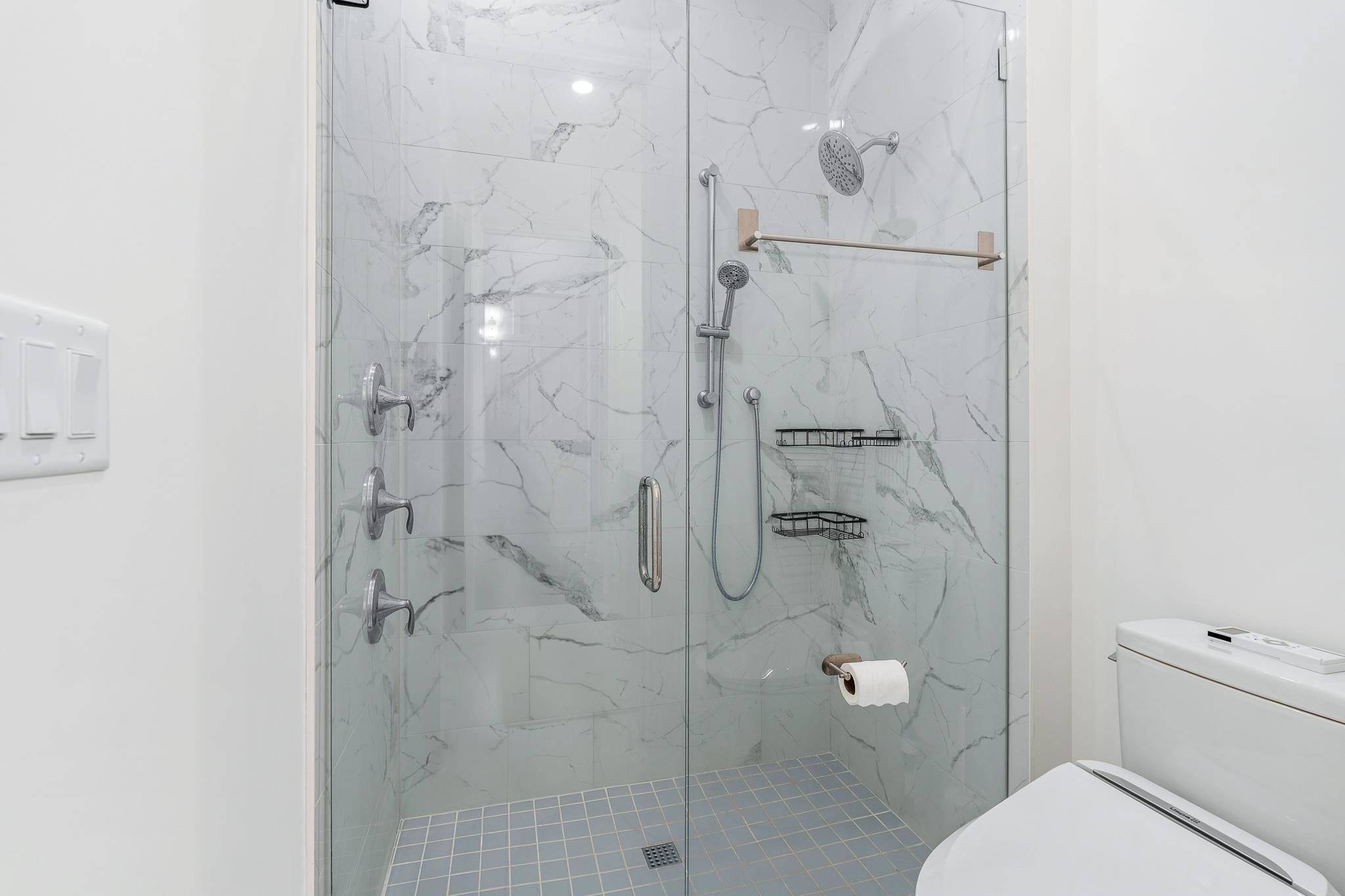 164 Tesoro Terrace St. Augustine, FL 32095 - Photo 43 of 98 a bathroom with a shower a toilet and sink