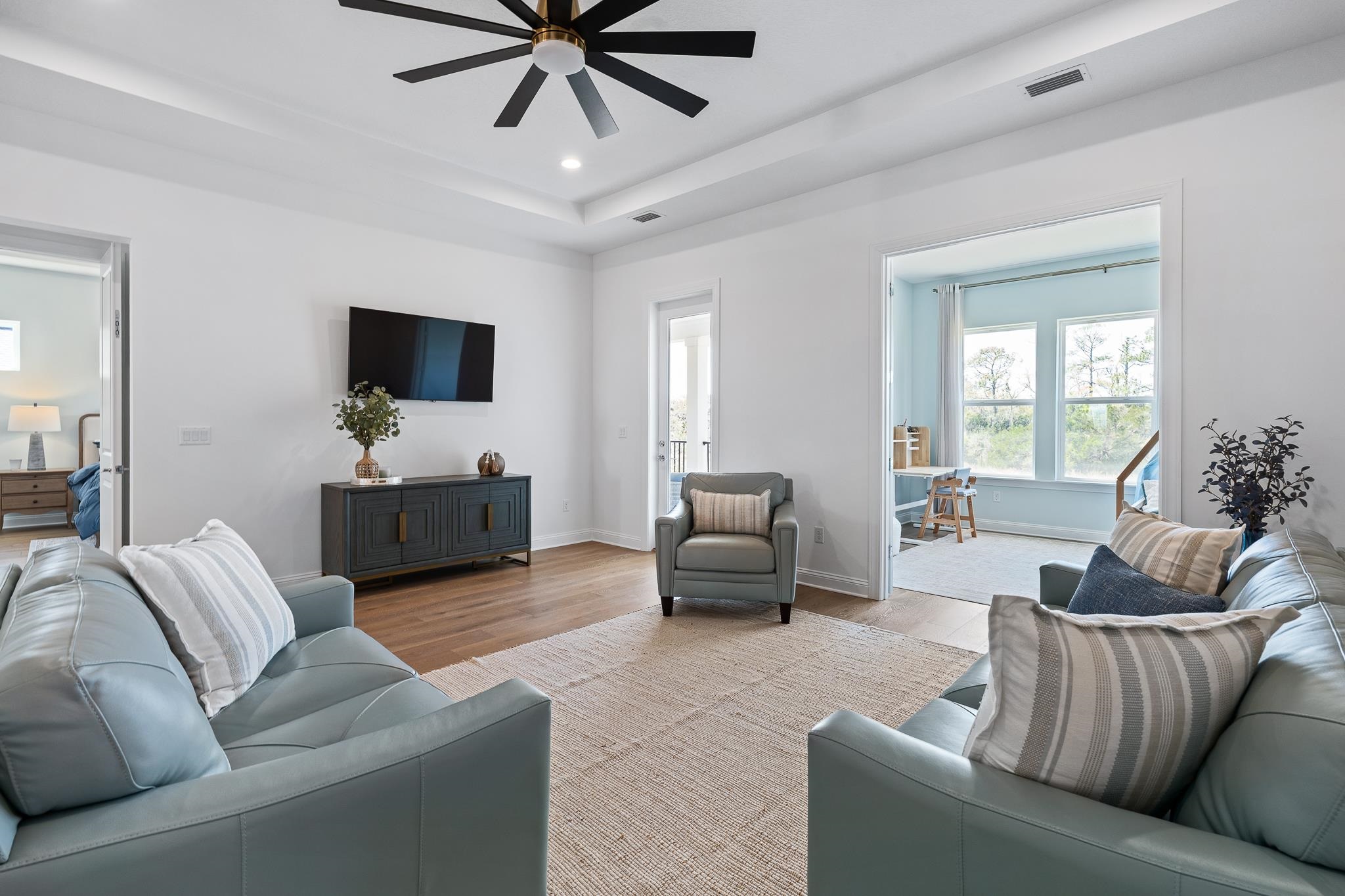 164 Tesoro Terrace St. Augustine, FL 32095 - Photo 49 of 98 a living room with furniture and a flat screen tv