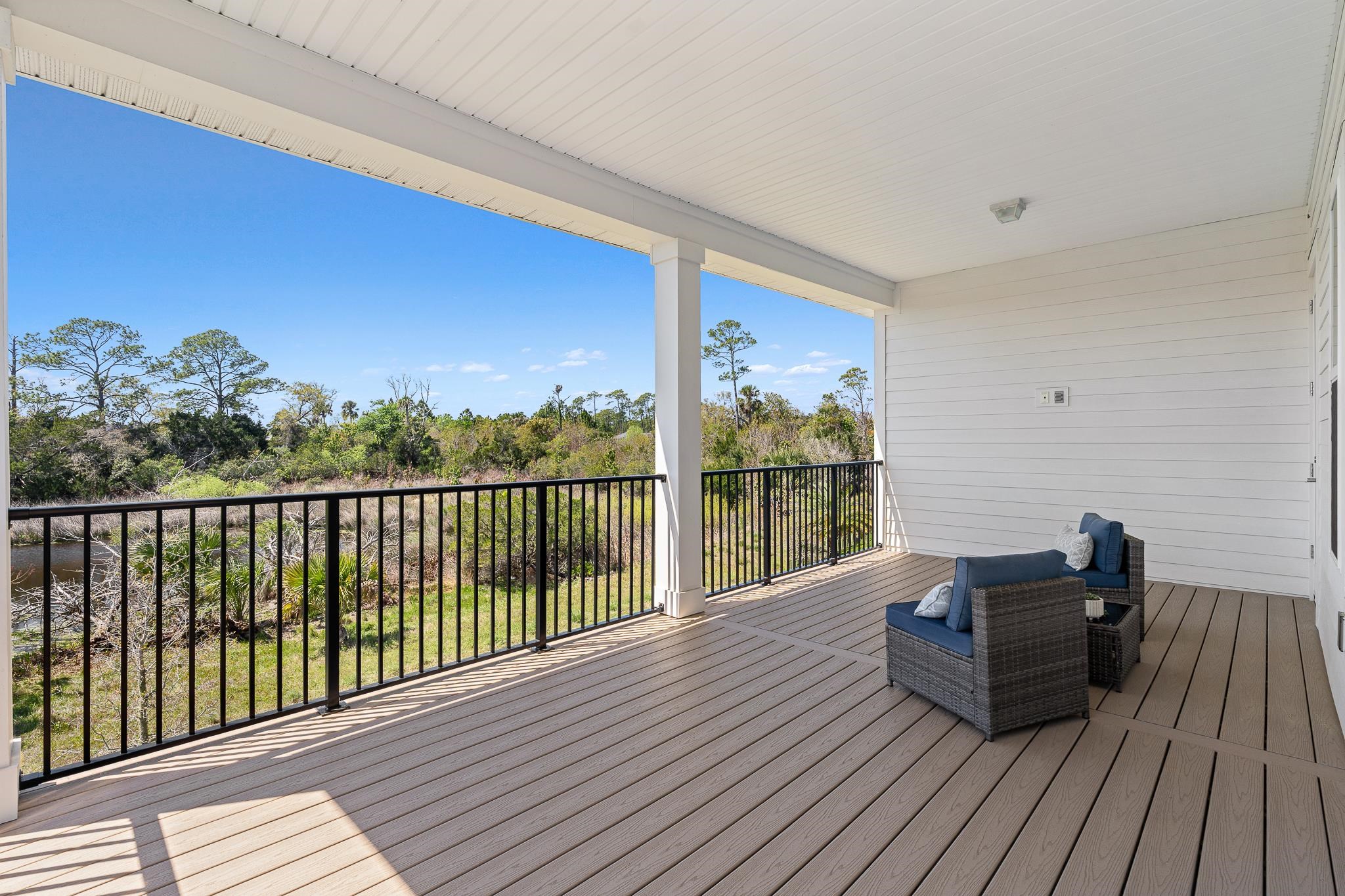 164 Tesoro Terrace St. Augustine, FL 32095 - Photo 52 of 98 a balcony with wooden floor table and chairs