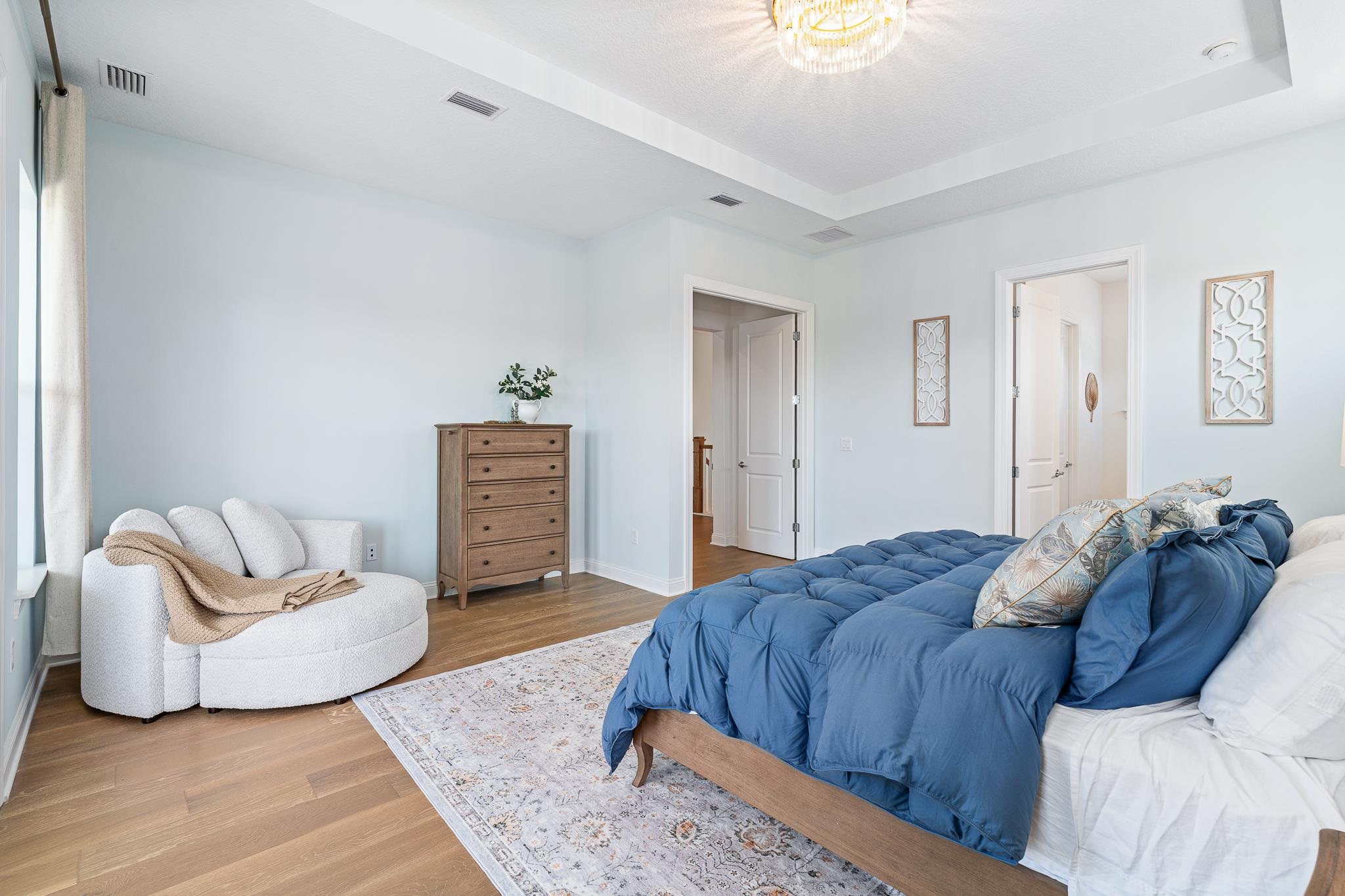 164 Tesoro Terrace St. Augustine, FL 32095 - Photo 53 of 98 a spacious bedroom with a bed and a couch