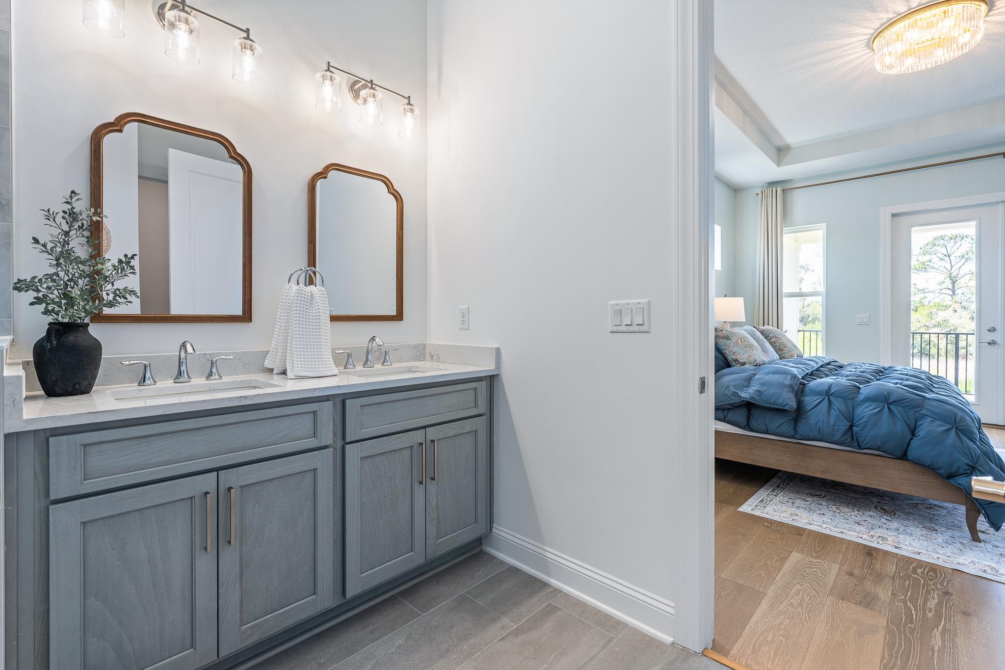 164 Tesoro Terrace St. Augustine, FL 32095 - Photo 55 of 98 a en suite bathroom with a double vanity sink and a mirror