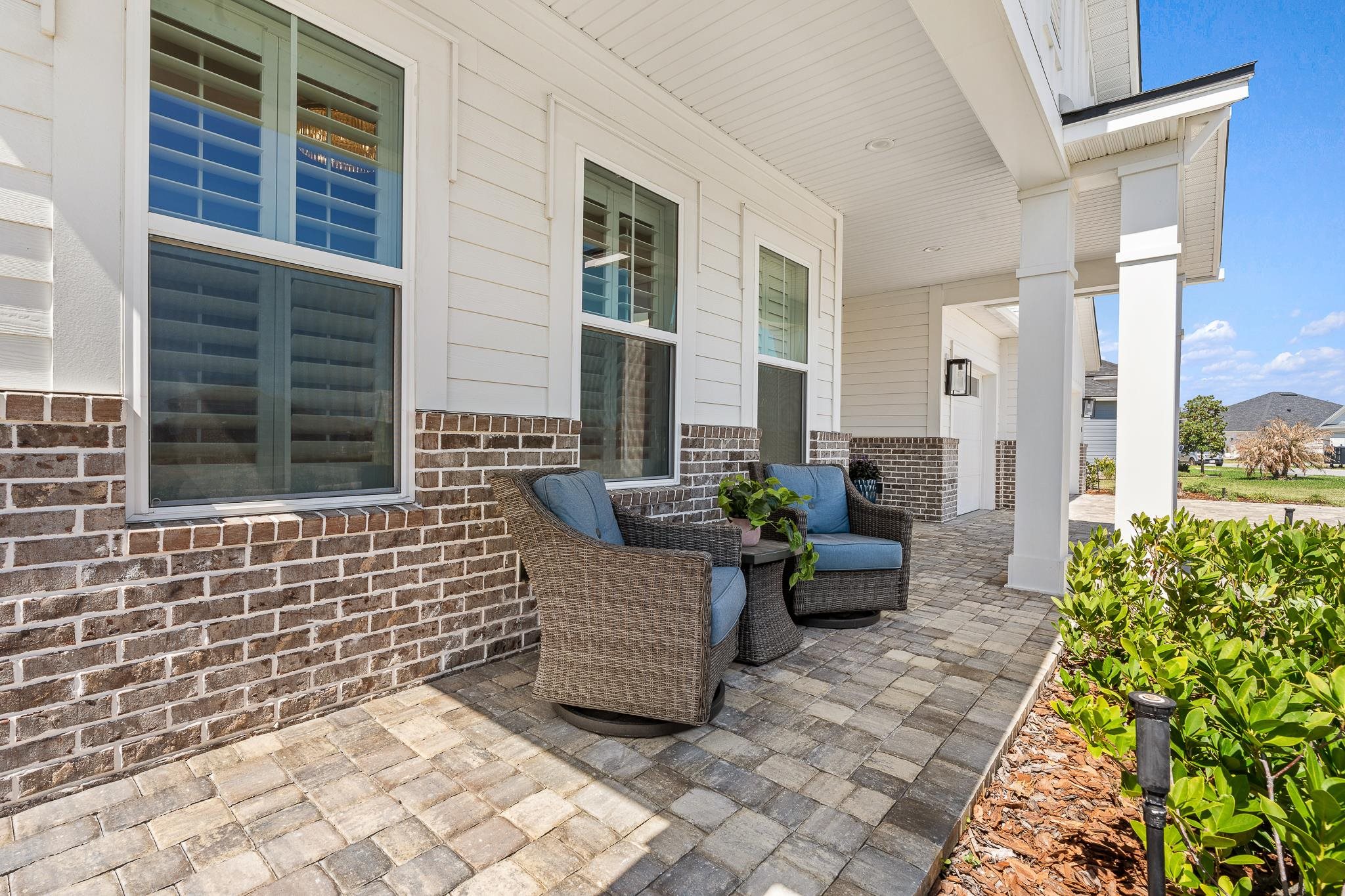 164 Tesoro Terrace St. Augustine, FL 32095 - Photo 76 of 98 a view of a patio with chairs and potted plants