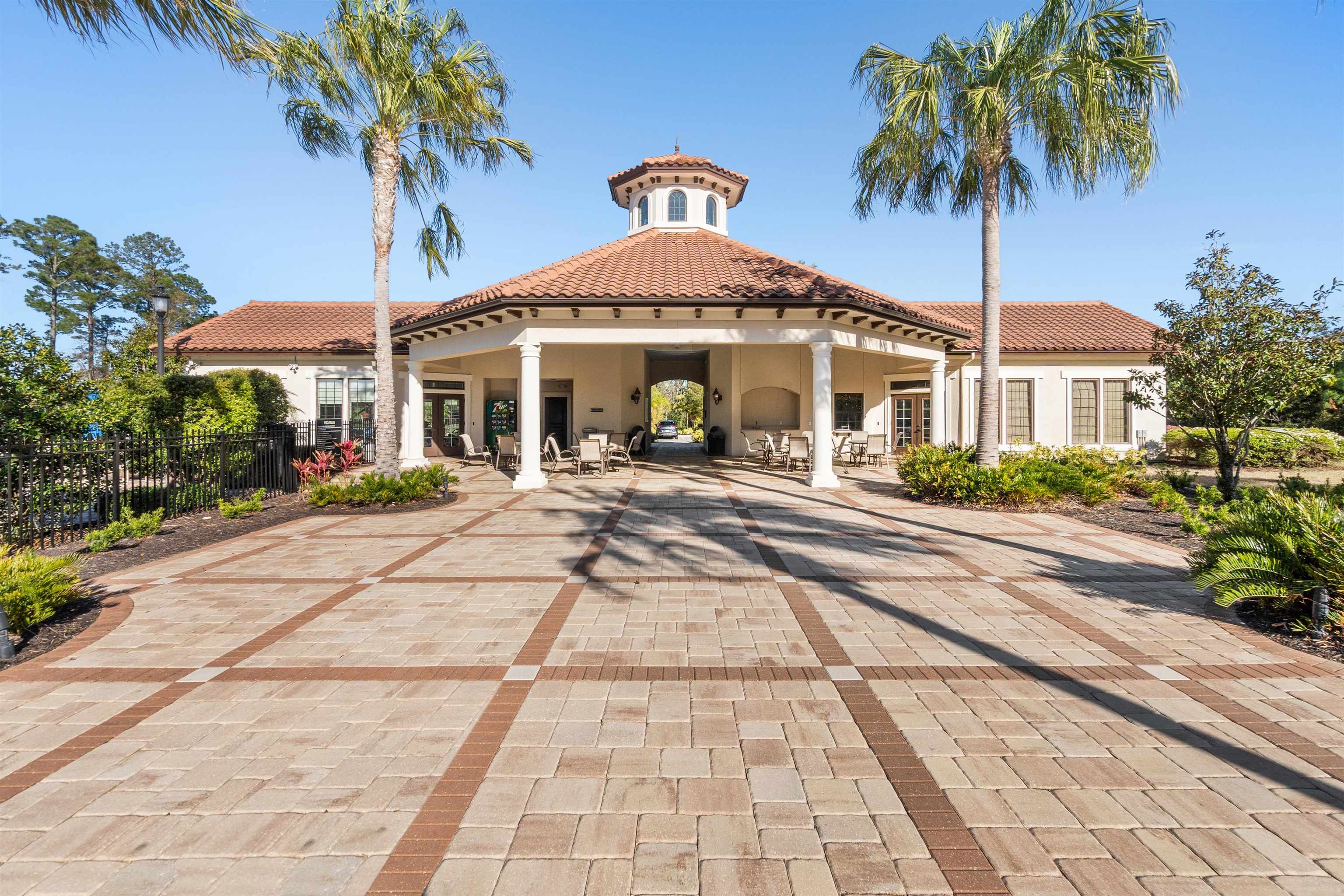 164 Tesoro Terrace St. Augustine, FL 32095 - Photo 95 of 98 a front view of a house with a yard