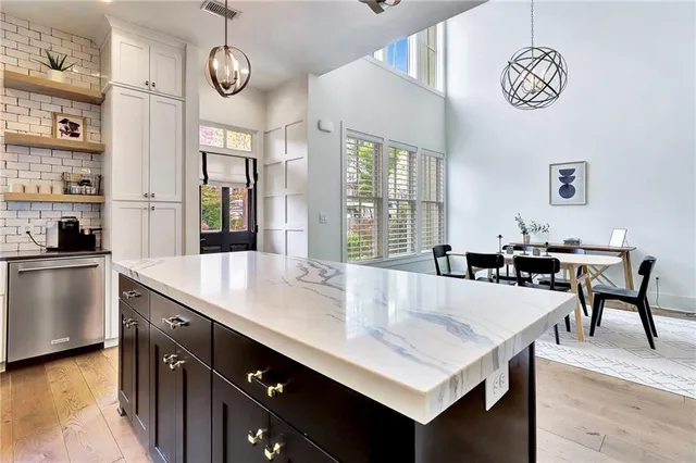 a large kitchen with a table and chairs