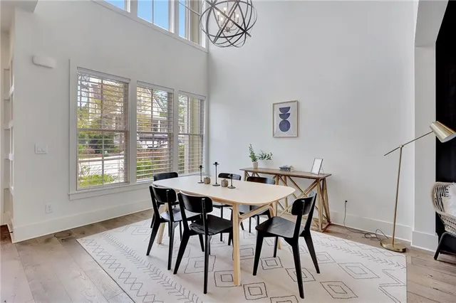 a view of a dining room with furniture and a window