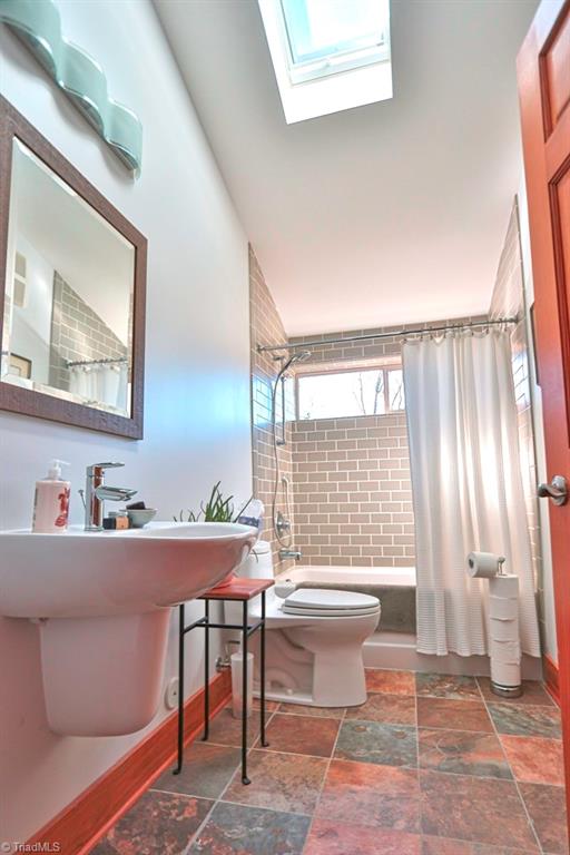 1045 West Old Phillips Road Pinnacle, NC 27043 - Photo 13 of 29 Second Bathroom features a skylight and tiled shower/tub.