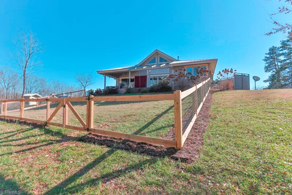 1045 West Old Phillips Road Pinnacle, NC 27043 - Photo 17 of 29 Fencing around the backyard for small ones.