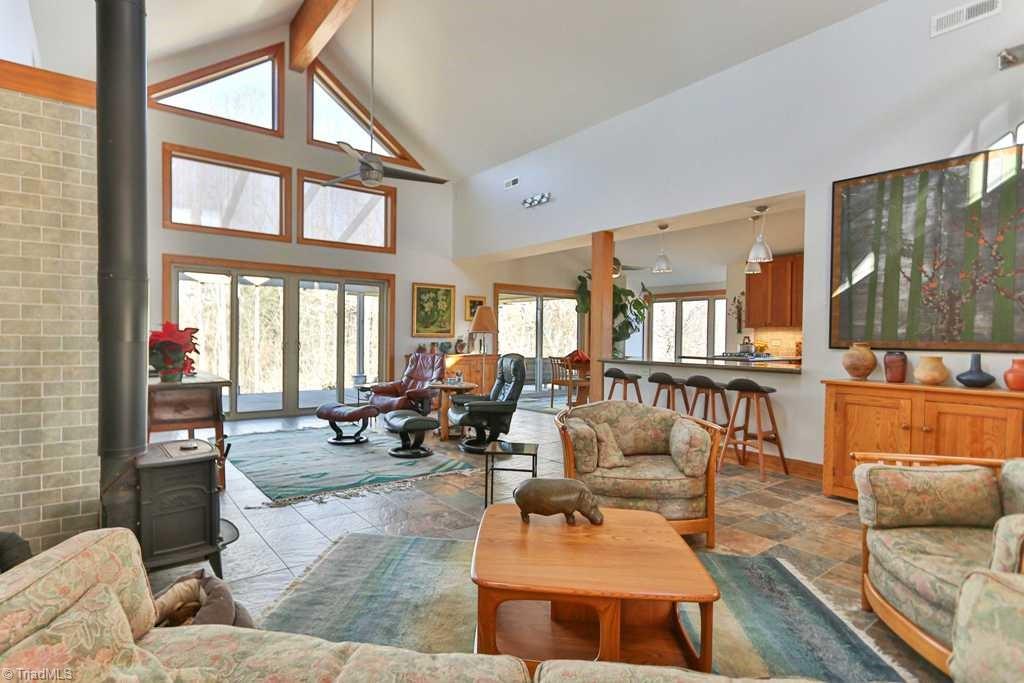 1045 West Old Phillips Road Pinnacle, NC 27043 - Photo 29 of 29 Open floor plan with vaulted ceiling. The home has a 5 Star Plus Energy Rating.