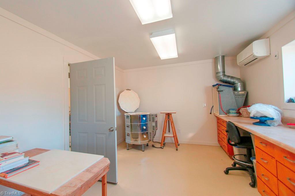 1045 West Old Phillips Road Pinnacle, NC 27043 - Photo 24 of 29 Studio space and workroom next door are conditioned with a split system heat pump.