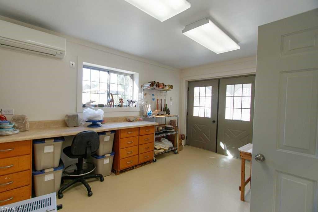 1045 West Old Phillips Road Pinnacle, NC 27043 - Photo 25 of 29 Workroom view with double doors.