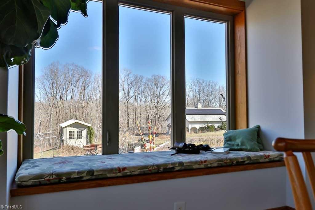1045 West Old Phillips Road Pinnacle, NC 27043 - Photo 5 of 29 Large windows in dining area let you enjoy views of the garden, birds and wildlife.