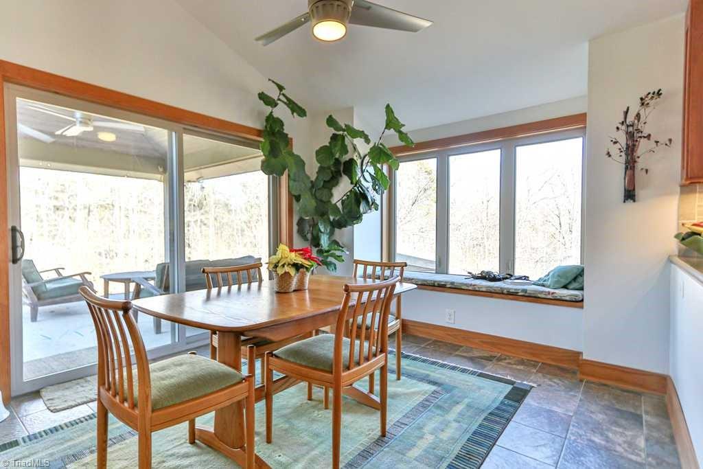 1045 West Old Phillips Road Pinnacle, NC 27043 - Photo 6 of 29 Dining area with covered patio just outside.