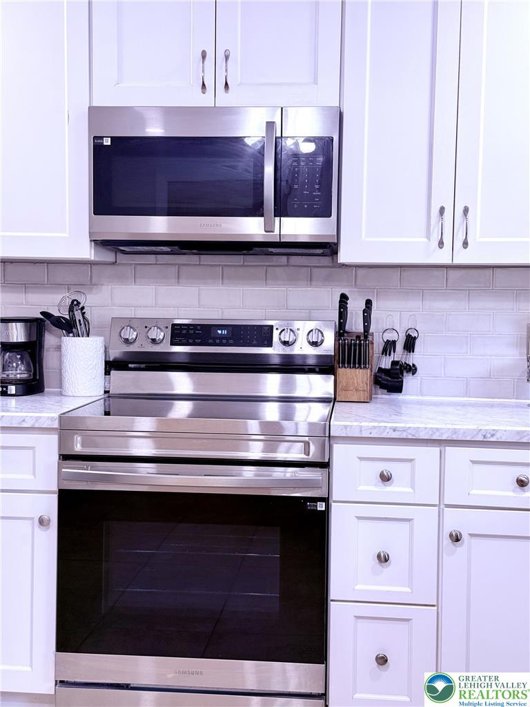 1275 Macada Road Bethlehem, PA 18017 - Photo 36 of 87 Culinary delights await in this bright kitchen with modern stainless steel appliances and ample cabinetry.