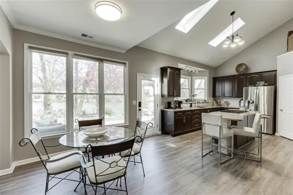 a kitchen with sink cabinets and stainless steel appliances