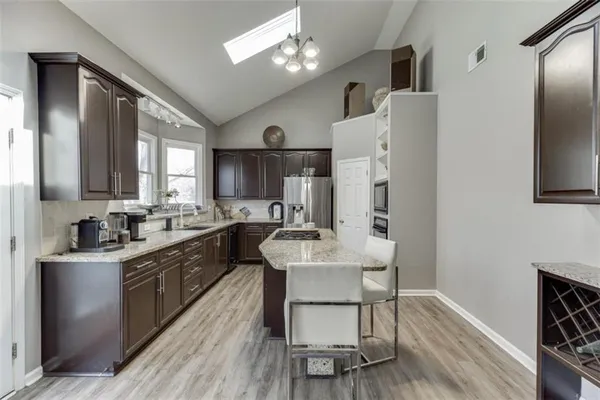 a kitchen with a stove and a microwave