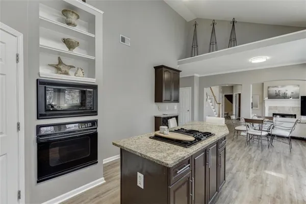 a living room with furniture window and a fireplace