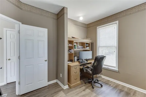 a bedroom with a bed and a television