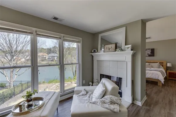 a spacious bathroom with a double vanity sink a mirror and a bathtub