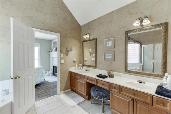 a backyard of a house with a yard and outdoor seating