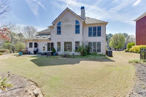an aerial view of a house with a lake view