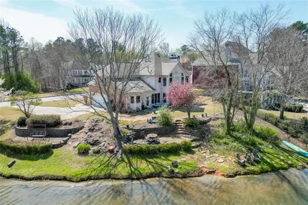 an outdoor space with furniture and garden