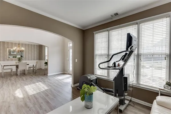 a view of a dining room with furniture and wooden floor