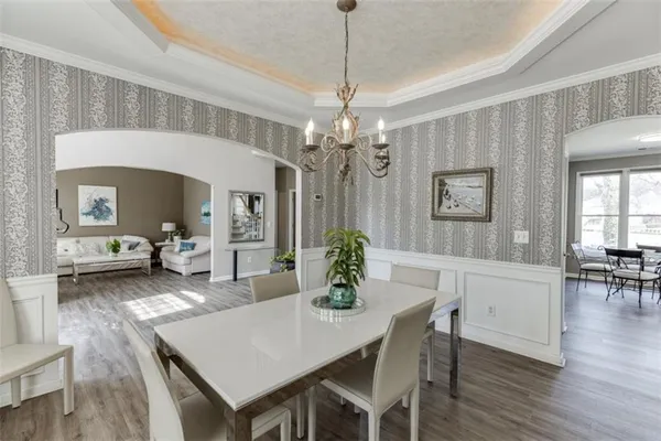 a view of a dining room with furniture and wooden floor