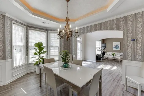 a large kitchen with sink a stove a refrigerator and a fireplace