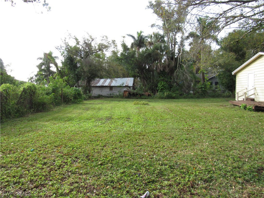 1140 River Road North Fort Myers, FL 33903 - Photo 15 of 17 a view of a green field with trees in the background