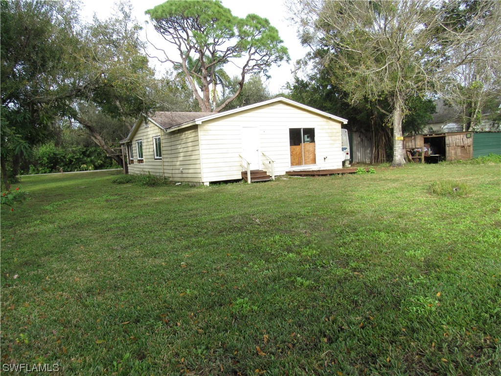 1140 River Road North Fort Myers, FL 33903 - Photo 17 of 17 a view of a backyard with a garden and entertaining space