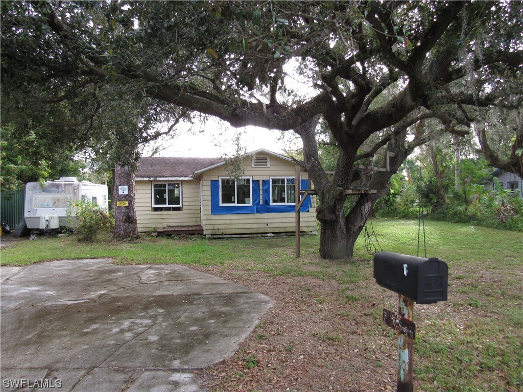 1140 River Road North Fort Myers, FL 33903 - Photo 3 of 17 a backyard of a house with yard table and chairs